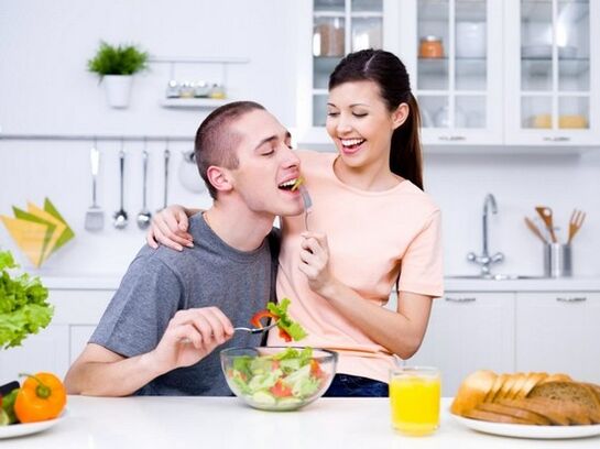 a woman feeds a man with products to naturally increase activity
